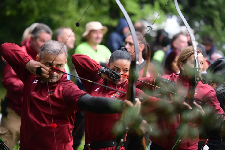 Serbian national team archers at full draw